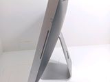 a computer monitor sitting on a stand in a room