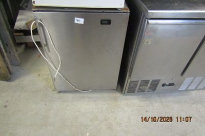 two refrigerators sitting next to each other in a room