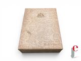 a book that is sitting on a white surface