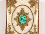 an antique picture frame with a picture of a woman in a frame
