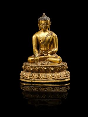 une image représentant une statue de Bouddha en or sur fond noir