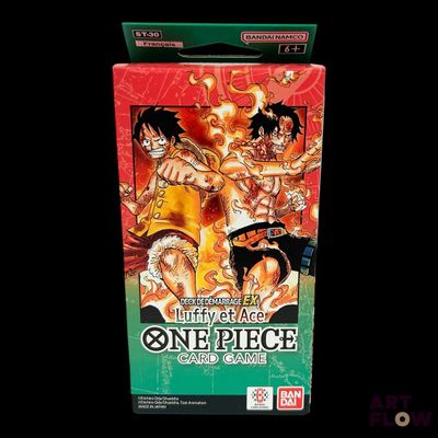 a box of one piece card game on a black background