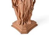 statue of a woman holding a child on a pedestal