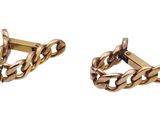 two pairs of gold tone cufflinks with twisted links