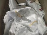 a cardboard box filled with a bunch of white items