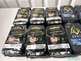 many bags of coffee that are sitting on a table