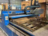 an image of a machine that is cutting a piece of wood