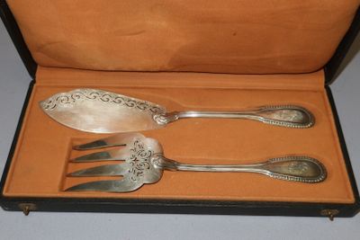 three spoons and a fork in a case