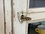 a close up of a door handle on a wooden door