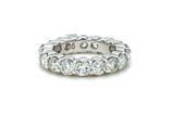 a close up of a diamond ring on a white background