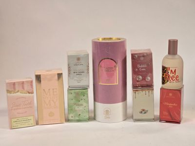 many different types of perfumes on a white surface