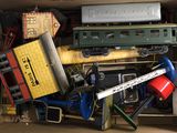 a box full of toy trains and other toys