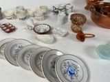 a lot of plates and bowls on the table