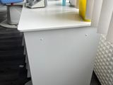 an image of a dentist ' s chair with a bottle of medicine on it