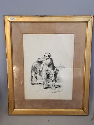 tableau représentant un chien et un chat, encadré et posé sur une table