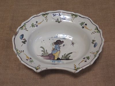a small bowl with a picture of a girl on it