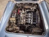 a small engine in the back of a blue car