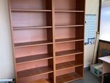 a room with a desk and a bookcase in it