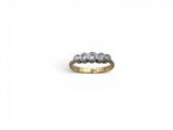 a close up of a ring with three diamonds on a white background