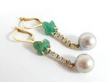 pair of green and white pearls and gold earrings on a white surface