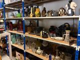 a shelf with many different items on it in a room