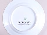 a white plate with a ceramique logo on it