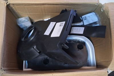 a cardboard box with a black object inside of it
