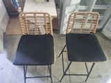 two chairs that are next to each other in a room