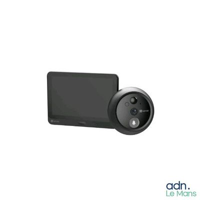 the small camera is sitting on the table next to the monitor