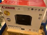 une imprimante Canon posée sur un carton