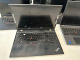 three laptops that are sitting on a table