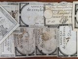 a close up of a book with a lot of papers on it