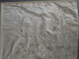 a close up of a piece of cloth with flowers on it