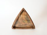 a triangle shaped wooden shelf with a map on it