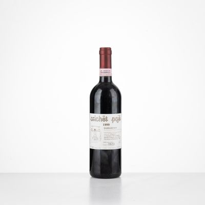 the bottle of red wine is sitting on the table