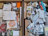 two boxes of assorted items sitting on the floor