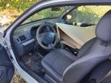 the interior of a car with the door open and the driver ' s seat up