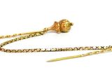 pair of gold plated earrings on white background with white background