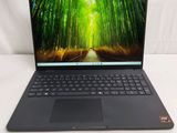 a close up of a laptop computer on a white surface