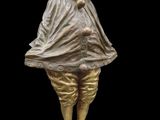 an image of a statue of a clown standing on a pedestal