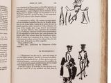someone is holding a book with a drawing of a man and a woman on it