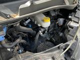 the engine of a car with the hood up and the hood down