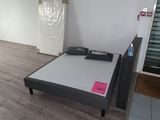 a bed that is in the middle of a room