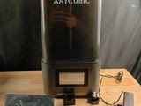 a small machine that is sitting on a wooden table