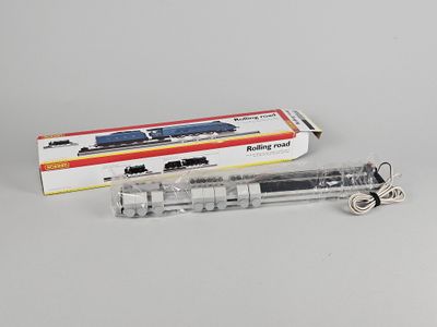 a close up of a toy train on a white surface