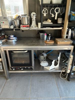 a kitchen with a stove, microwave, and other appliances
