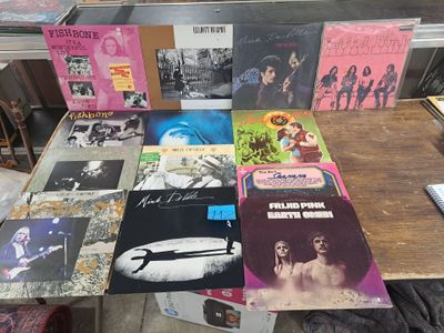 a lot of records on a table in a room