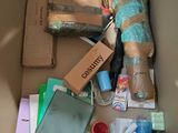 a cardboard box filled with assorted items in it