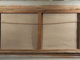 a picture of an old window with a rope hanging from it