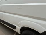 a white van parked on the side of the road